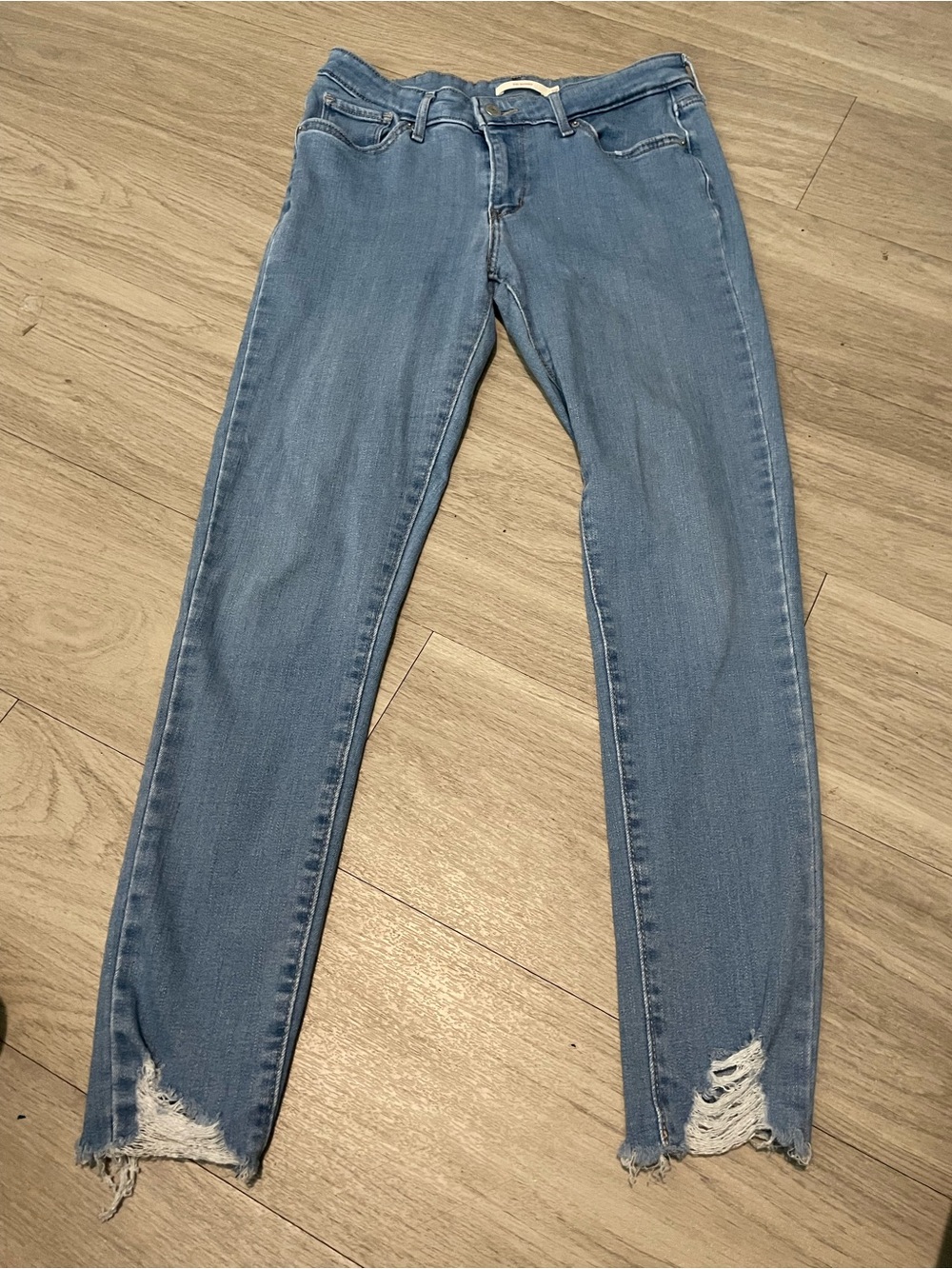 Levi's Women's Light Blue Skinny Jeans with Distressed Hem